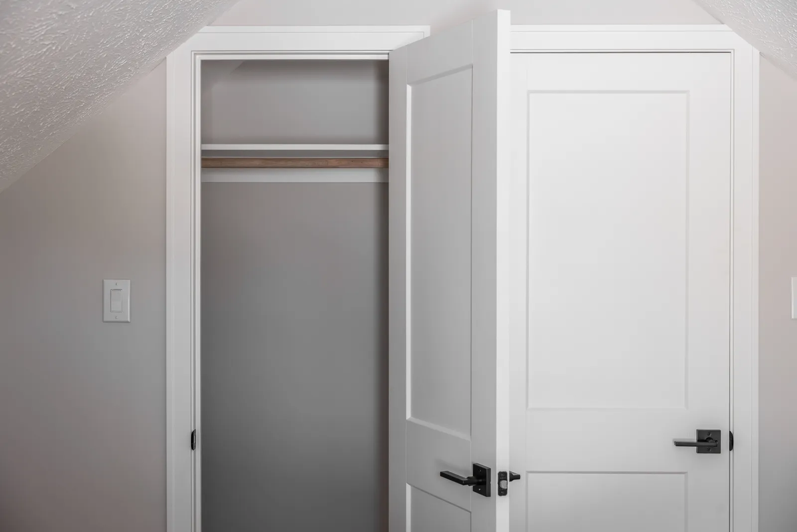 Closet interior with wood rod and shelf